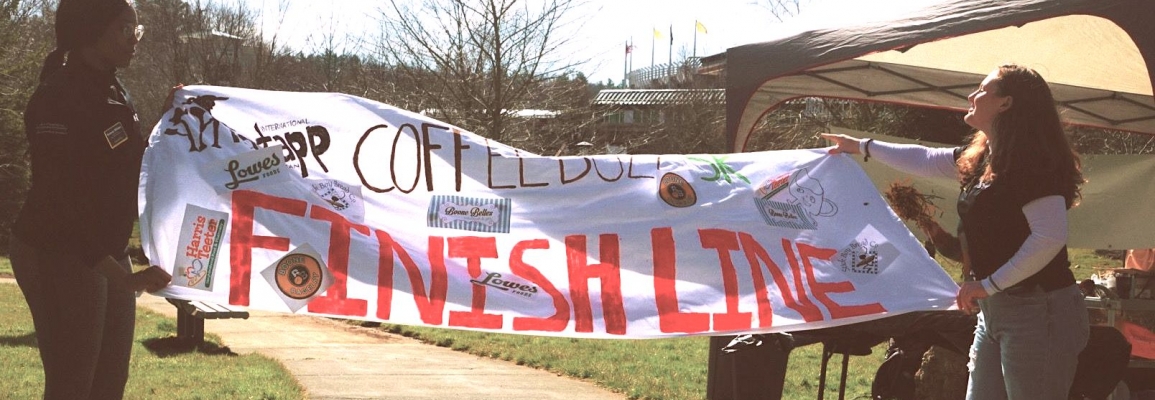 finish line banner with Kennedy and Ellie 